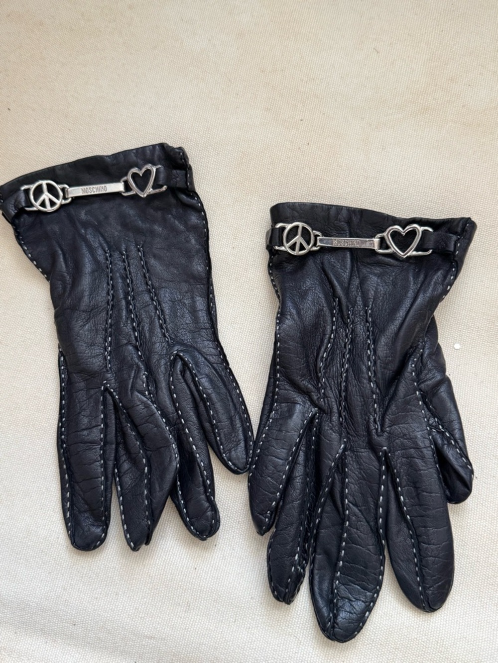 Rare Moschino 100% leather black gloves 100% silk lined peace heart hardware